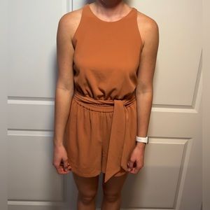 Burnt orange romper with a waist tie. Very comfortable and thick material